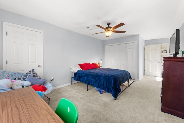 carpeted bedroom with a closet and ceiling fan