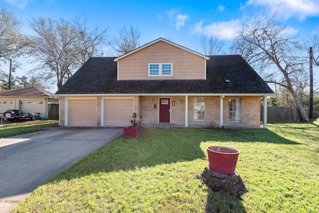 view of front of home featuring a front yard and a garage