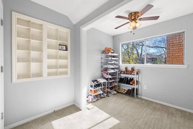 interior space featuring carpet flooring, ceiling fan, and lofted ceiling