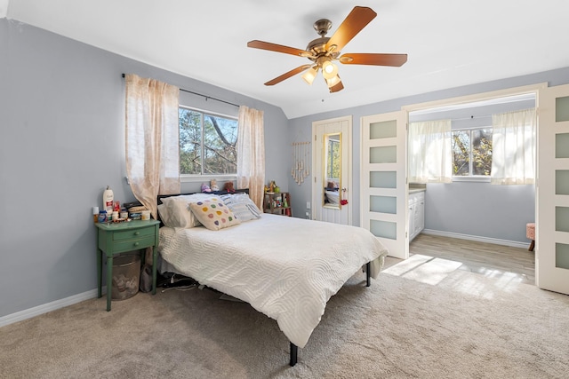 bedroom with ceiling fan and light colored carpet