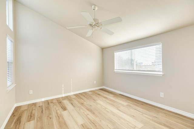 unfurnished room with ceiling fan, light hardwood / wood-style flooring, and vaulted ceiling