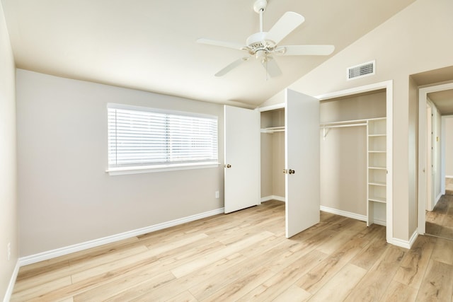 unfurnished bedroom featuring ceiling fan, light wood-type flooring, and vaulted ceiling