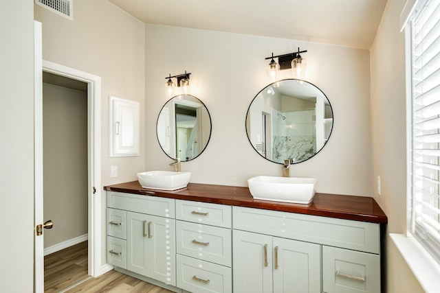 bathroom featuring vanity and hardwood / wood-style flooring