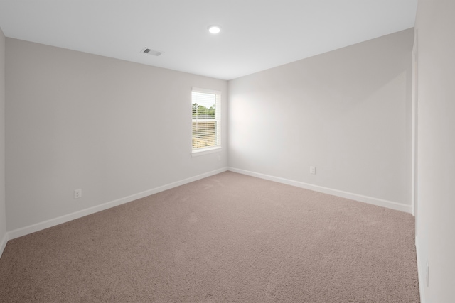 empty room with carpet flooring