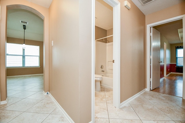 hallway with light tile patterned flooring