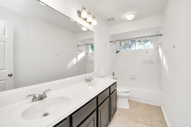 full bathroom with tile patterned floors, vanity, toilet, and washtub / shower combination