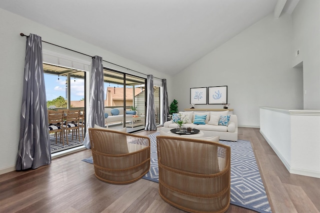 living room with high vaulted ceiling and wood-type flooring