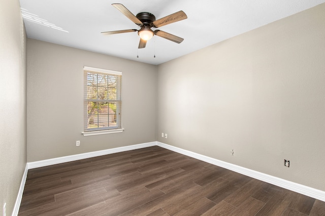 unfurnished room featuring dark hardwood / wood-style flooring and ceiling fan