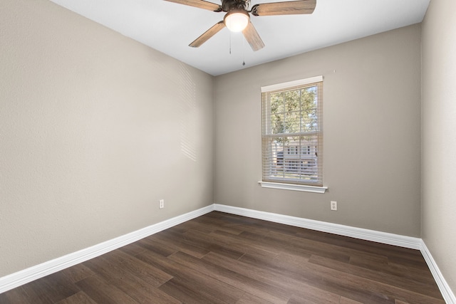 unfurnished room featuring ceiling fan and dark wood-type flooring