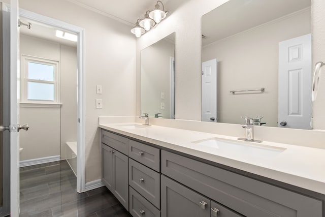 bathroom with vanity and crown molding