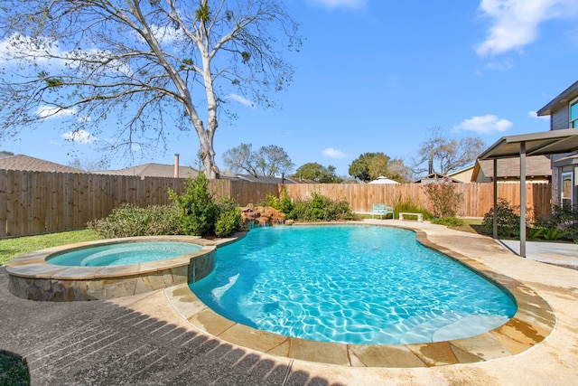 view of swimming pool with an in ground hot tub