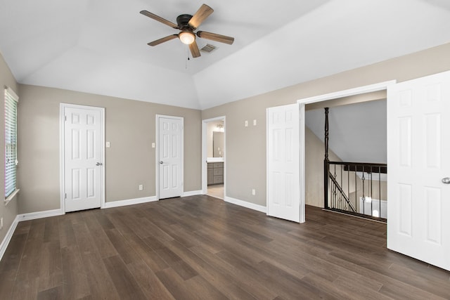 interior space with dark hardwood / wood-style floors, vaulted ceiling, and ceiling fan