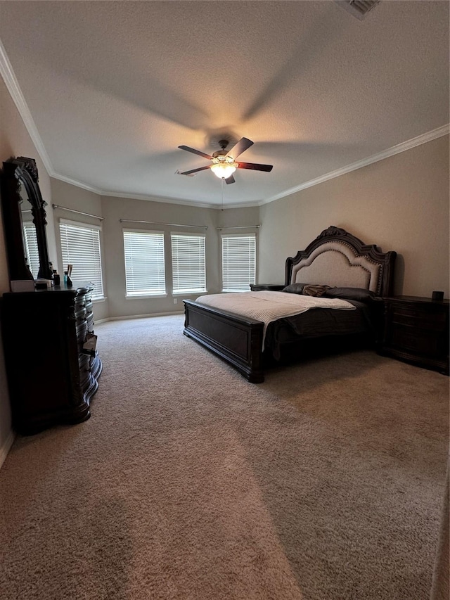 bedroom featuring ceiling fan, carpet floors, a textured ceiling, and ornamental molding