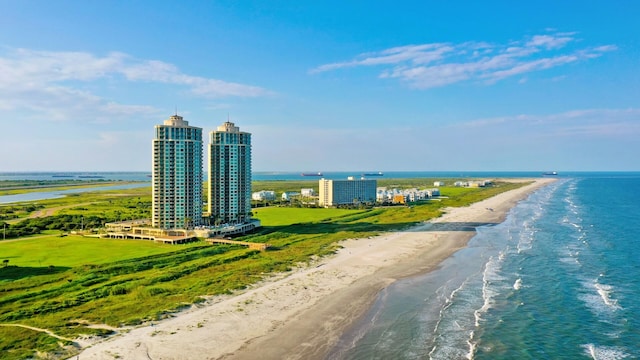 drone / aerial view with a beach view and a water view