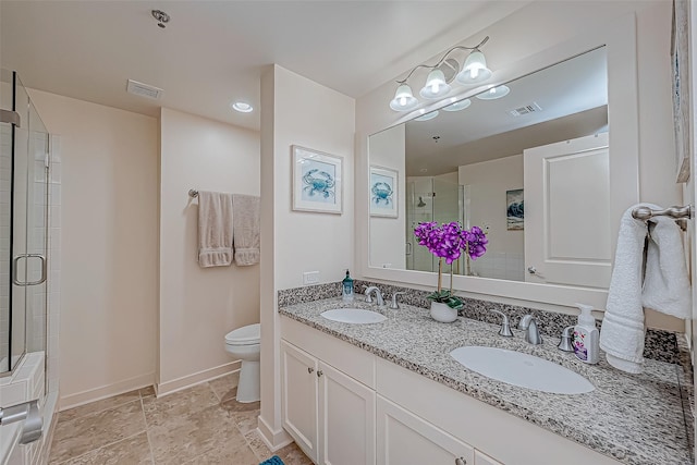 full bathroom with toilet, visible vents, a tile shower, and a sink