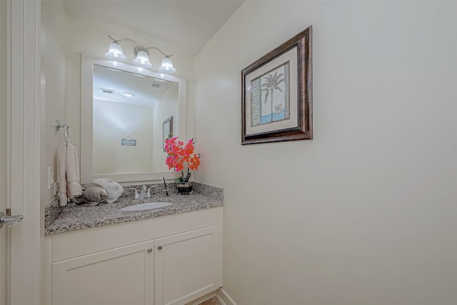 bathroom with visible vents and vanity