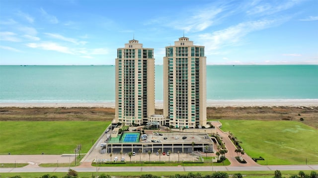 birds eye view of property with a view of the beach and a water view