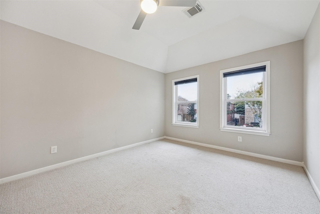 carpeted spare room with ceiling fan