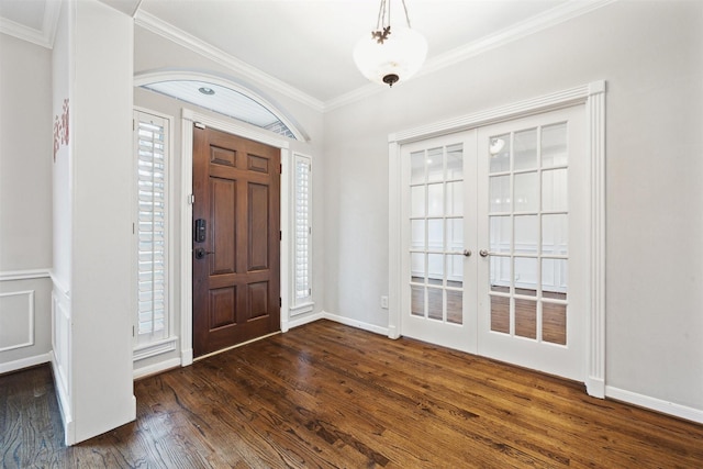 entryway featuring dark hardwood / wood-style floors, crown molding, and french doors