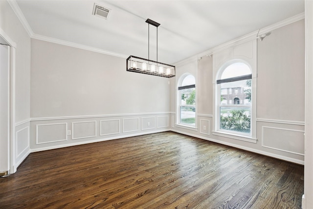 unfurnished dining area featuring dark wood-type flooring and ornamental molding