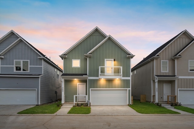 view of front of property featuring a balcony and a garage