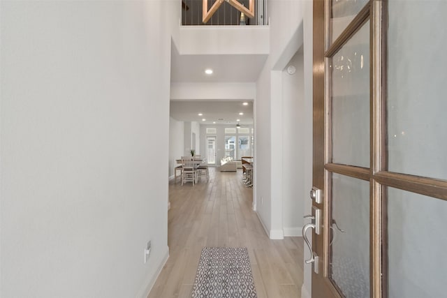 hallway with light wood-type flooring