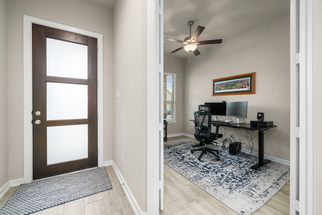 office area with ceiling fan and light hardwood / wood-style floors