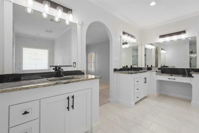 bathroom featuring vanity and ornamental molding