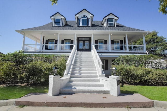 view of front facade featuring french doors and covered porch