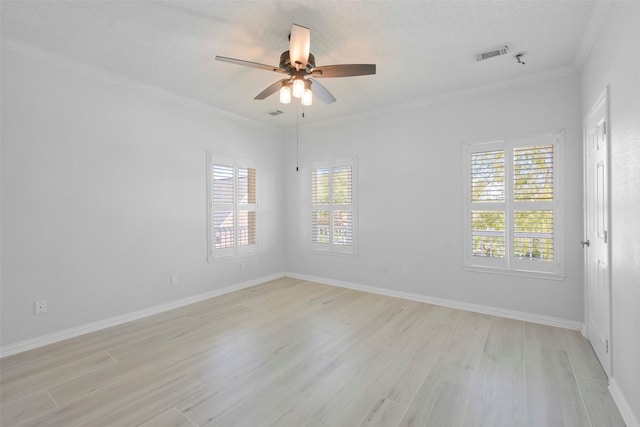 unfurnished room featuring a textured ceiling, light hardwood / wood-style floors, ceiling fan, and ornamental molding