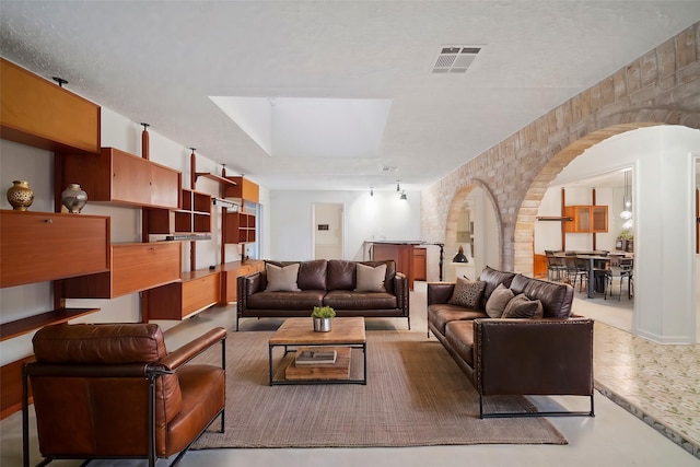 living room featuring concrete floors