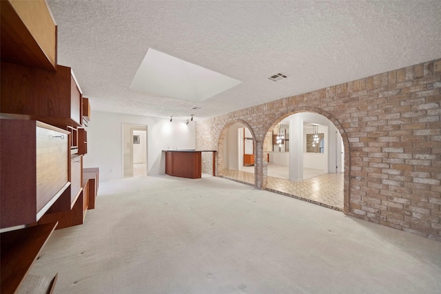 unfurnished room with light colored carpet