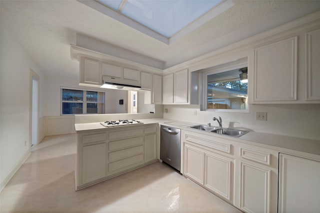 kitchen featuring stainless steel dishwasher, white gas cooktop, kitchen peninsula, and sink