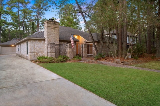 view of front facade with a garage and a front lawn