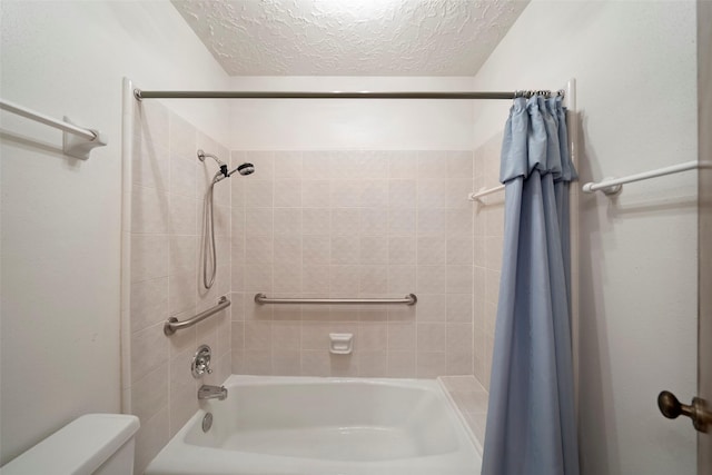 bathroom with toilet, a textured ceiling, and shower / tub combo with curtain