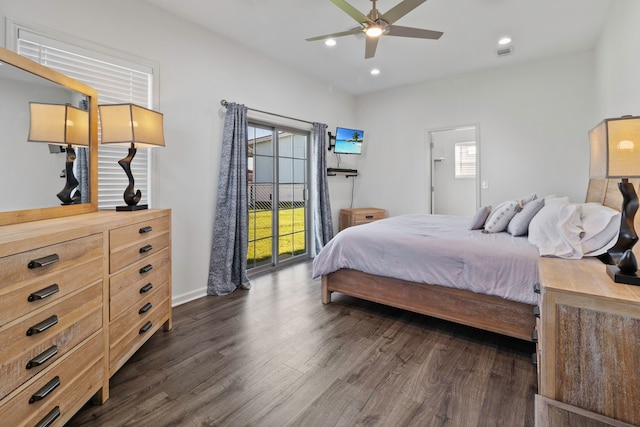 bedroom with dark hardwood / wood-style flooring, multiple windows, ceiling fan, and access to outside