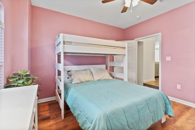 bedroom with hardwood / wood-style flooring and ceiling fan