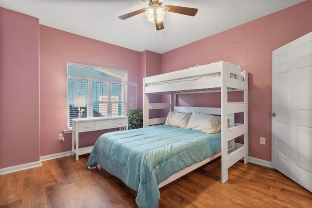 bedroom featuring hardwood / wood-style flooring and ceiling fan