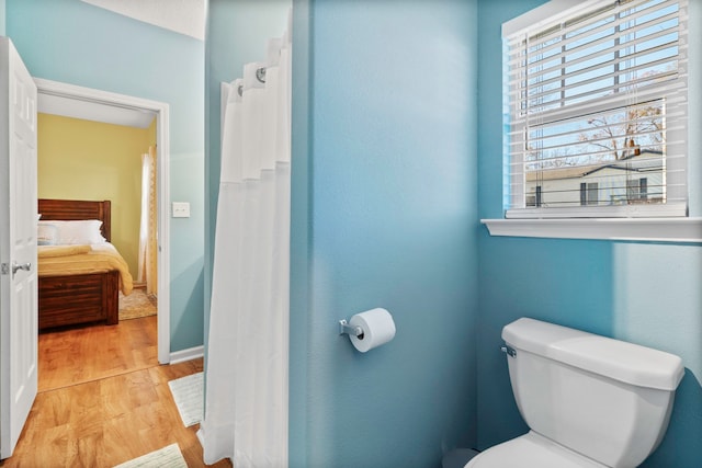 bathroom featuring toilet and hardwood / wood-style floors