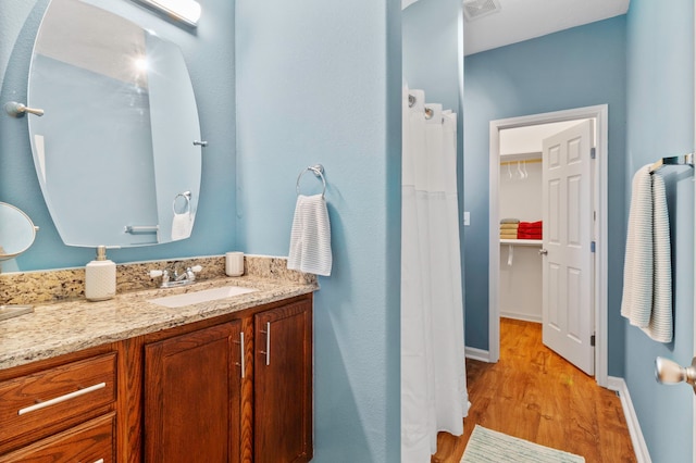 bathroom featuring hardwood / wood-style flooring and vanity