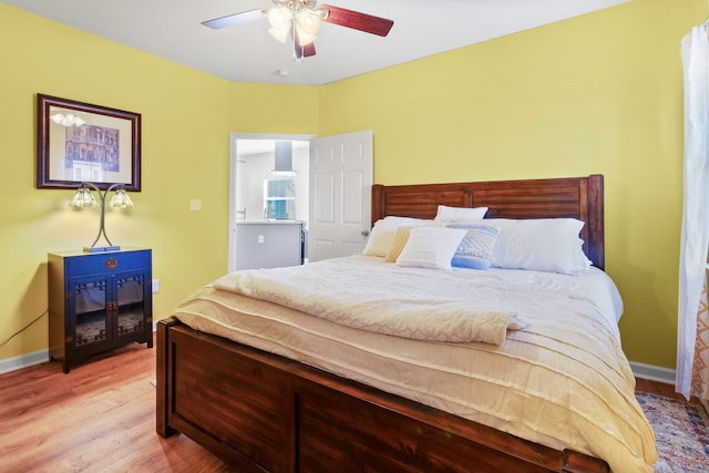 bedroom with ceiling fan and light hardwood / wood-style flooring