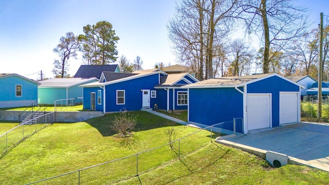 ranch-style home featuring a garage and a front lawn