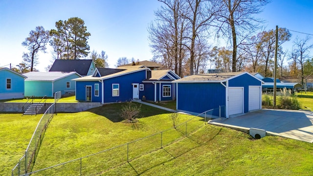 single story home with a front lawn and an outbuilding