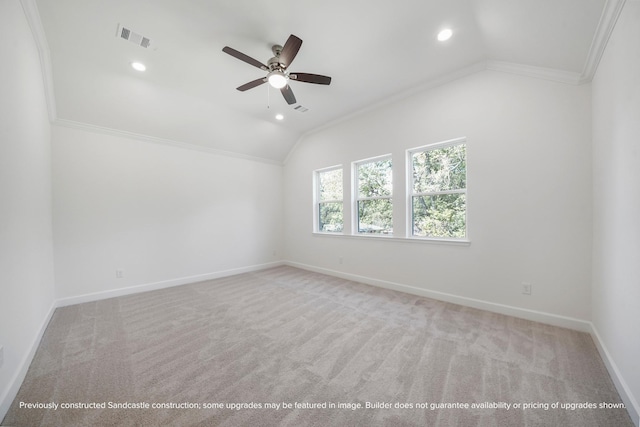 spare room with light carpet, crown molding, ceiling fan, and lofted ceiling