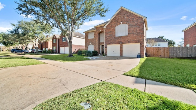 front facade featuring a front yard and a garage