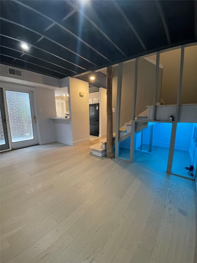 basement with wood-type flooring