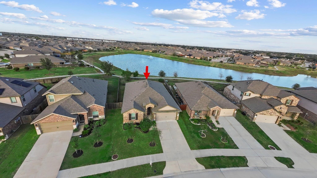 birds eye view of property featuring a water view