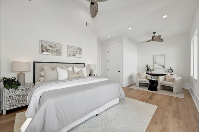 bedroom with ceiling fan and light hardwood / wood-style floors