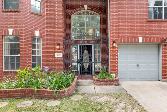 view of exterior entry with a garage