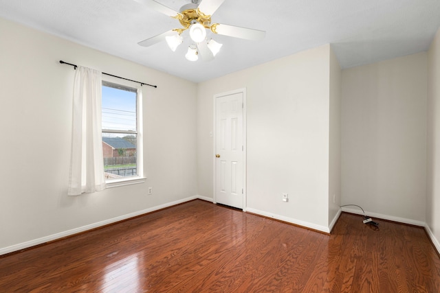 empty room with ceiling fan and hardwood / wood-style floors